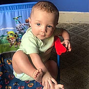Otis is registered to the contest to win money with this photo: toddler, child, baby, chair, paw_patrol, foot, hand, indoor, carpet, blue_wall, socks, playing, curious, cute, clothing, person, furniture, toy_chair, casual, young_child
