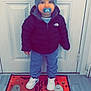 child, baby, pacifier, hat, jacket, sneakers, door, doormat, floor, indoor, clothing, standing, north_face, blue_pants, white_shoes, halloween, ghosts, trick_or_treat, cute, winter_wear