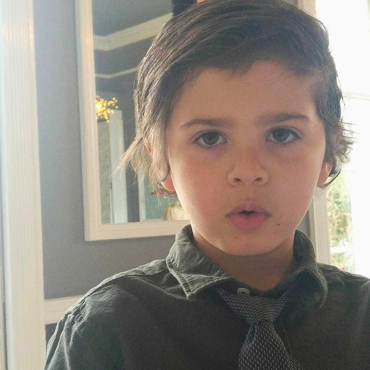 Trelly joined the competition — help win amazing prizes! background, boy, casual, child, curly_hair, expression, face, hair, home, indoor, lighting, looking_at_camera, mirror, natural_light, person, portrait, shirt, tie, window, young