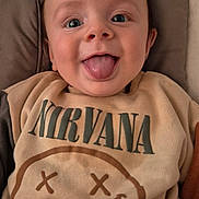 Alexander joined the competition — help win amazing prizes! baby, child, tongue_out, smiling, face, sweatshirt, nirvana, clothing, baby_seat, cushion, toy_rings, happy, indoor, cute, infant, person, portrait, young_child, cozy, casual