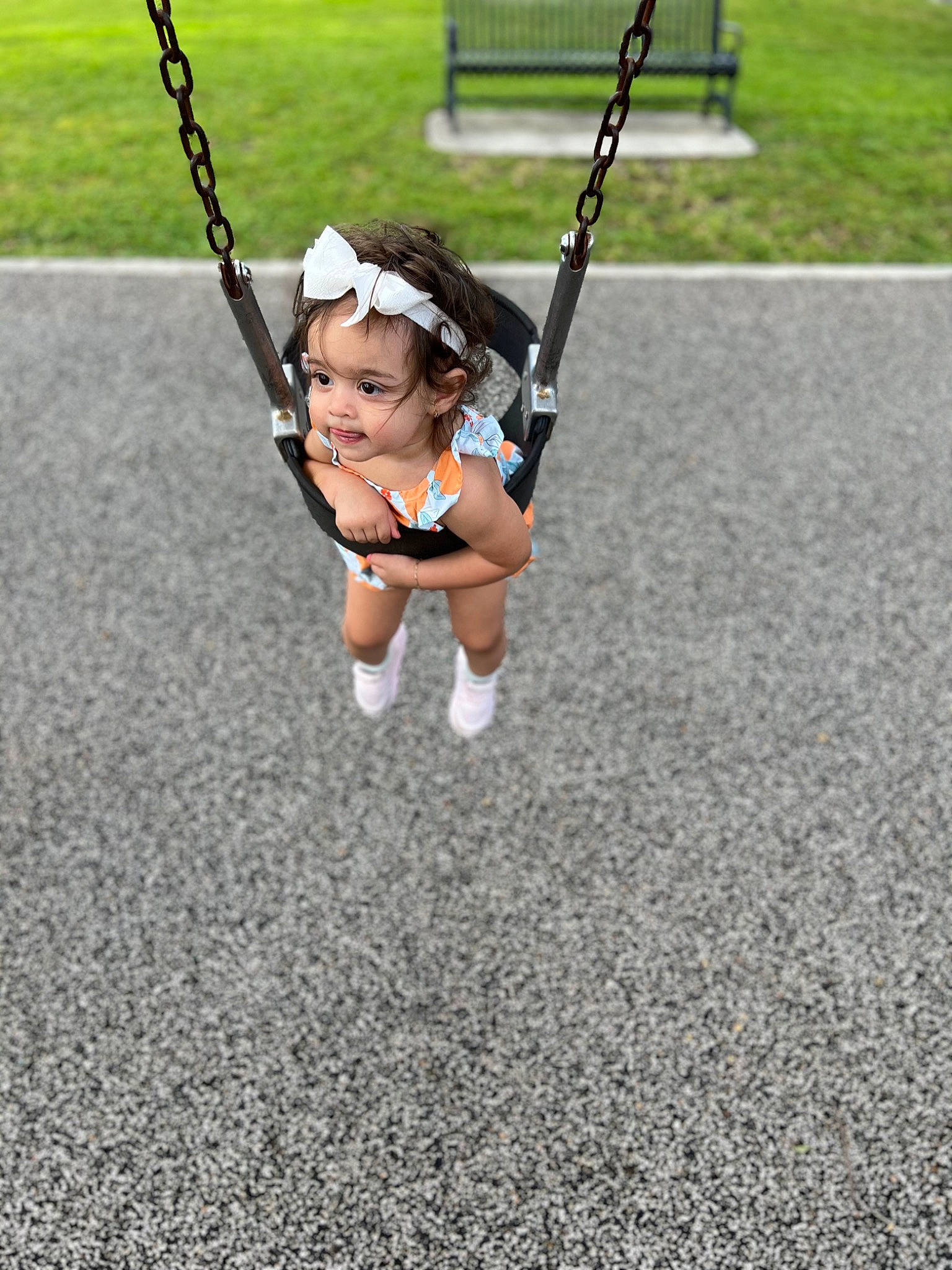 Sophia joined the competition — help win amazing prizes! asphalt, child, electric_blue, fashion_accessory, fun, grass, human_leg, jewellery, knee, leisure, outdoor_play_equipment, person, plant, play, playground, recreation, road_surface, sports, sportswear, swing