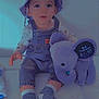 toddler, child, hat, bucket_hat, denim_overalls, plush_toy, elephant, purple, striped_socks, sitting, indoors, cute, baby_clothes, childrens_fashion, smiling, young_child, face, person, cushion, white_background