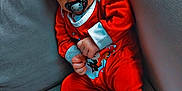 Kezio participe au concours pour gagner de l'argent avec cette photo : baby, casual, child, couch, cozy, cute, hat, holiday_outfit, indoor, infant, one_person, pacifier, person, portrait, red_clothing, relaxed, sleepy, socks, soft_furniture, young_child
