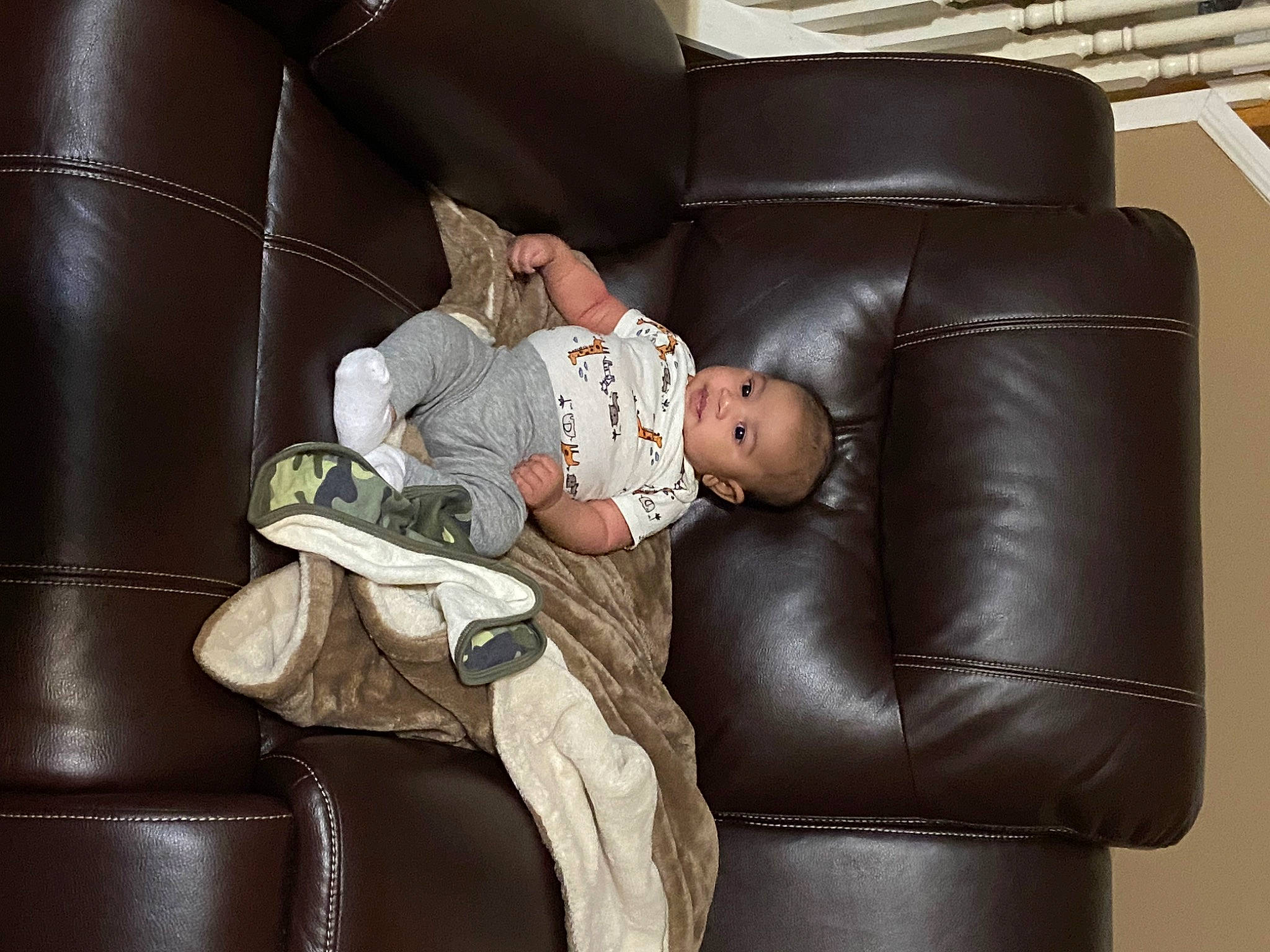 Braylen is registered to the contest to win money with this photo: baby, comfort, couch, flooring, fur, furniture, human_leg, lap, leather, leather_jacket, leisure, living_room, luxury_vehicle, person, room, sitting, sofa_bed, studio_couch, throw_pillow, toddler