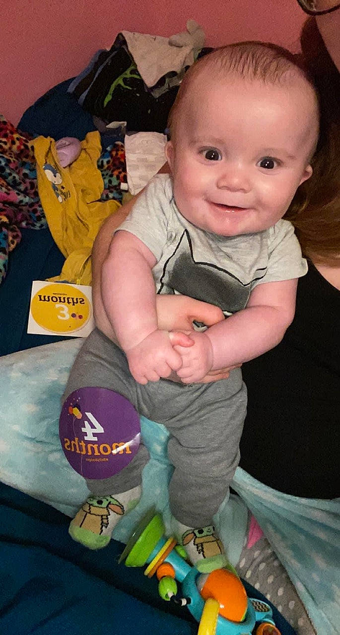 Shawn is registered to the contest to win money with this photo: baby, baby_products, baby_toddler_clothing, cheek, child, fun, happy, iris, joy, people, person, sitting, skin, sleeve, smile, sock, t_shirt, thumb, toddler