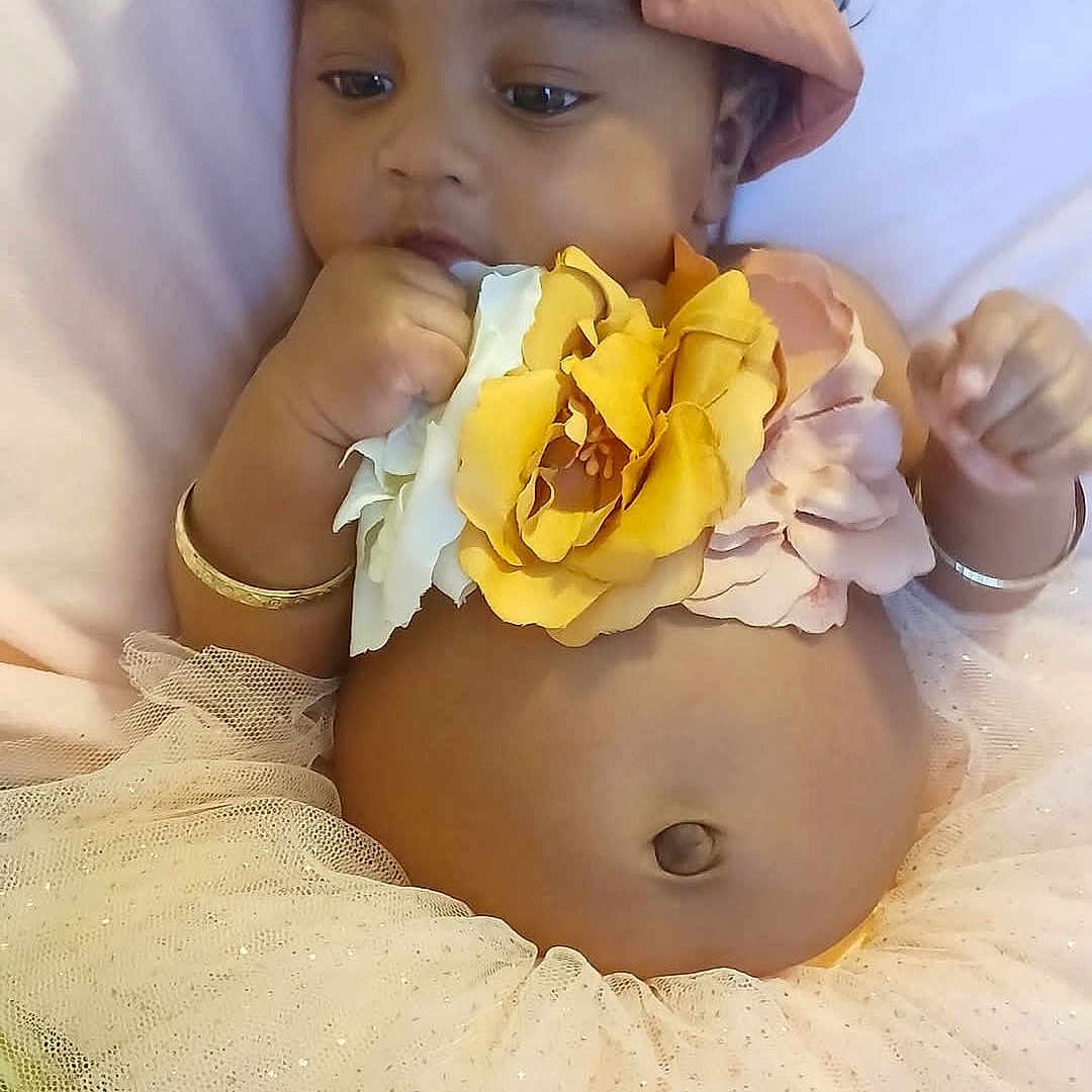 Janiiya joined the competition — help win amazing prizes! accessories, baby, bracelet, clothing, earring, face, flower, happy, head, jewelry, necklace, person, petal, photography, plant, portrait, rose, scarf, sitting, smile