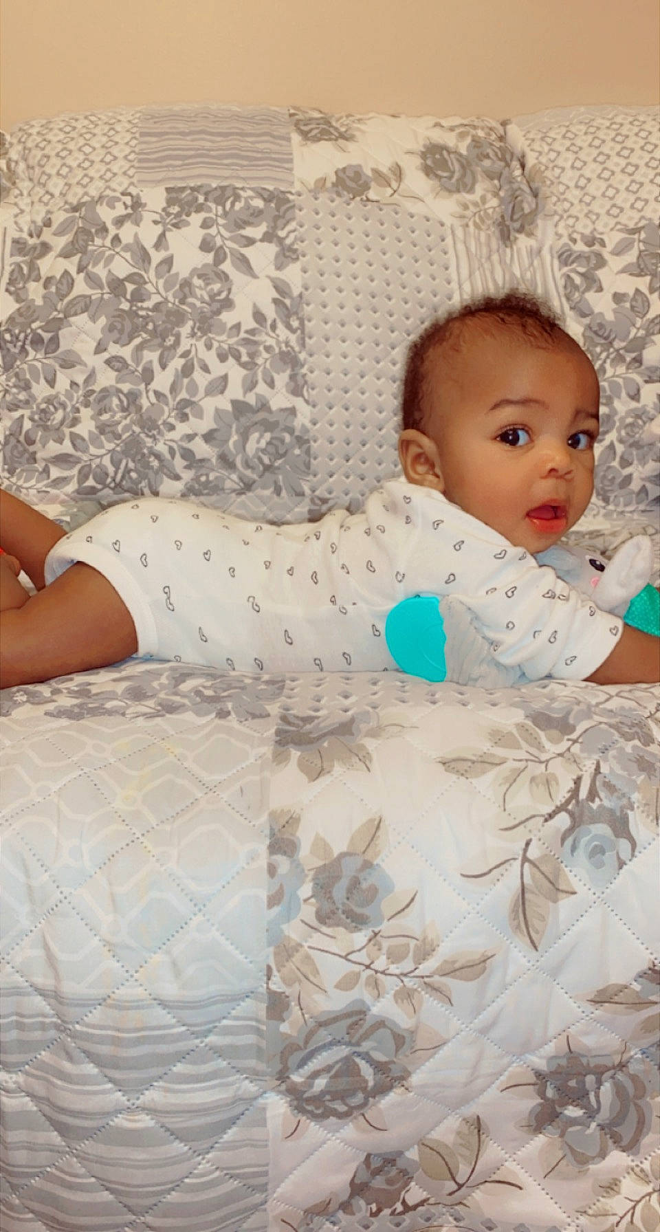 Zaniyah joined the competition — help win amazing prizes! baby, baby_toddler_clothing, beauty, bedding, child, comfort, floor, flooring, happy, human_leg, knee, linens, pattern, person, room, sitting, skin, sleeve, surprise, thigh