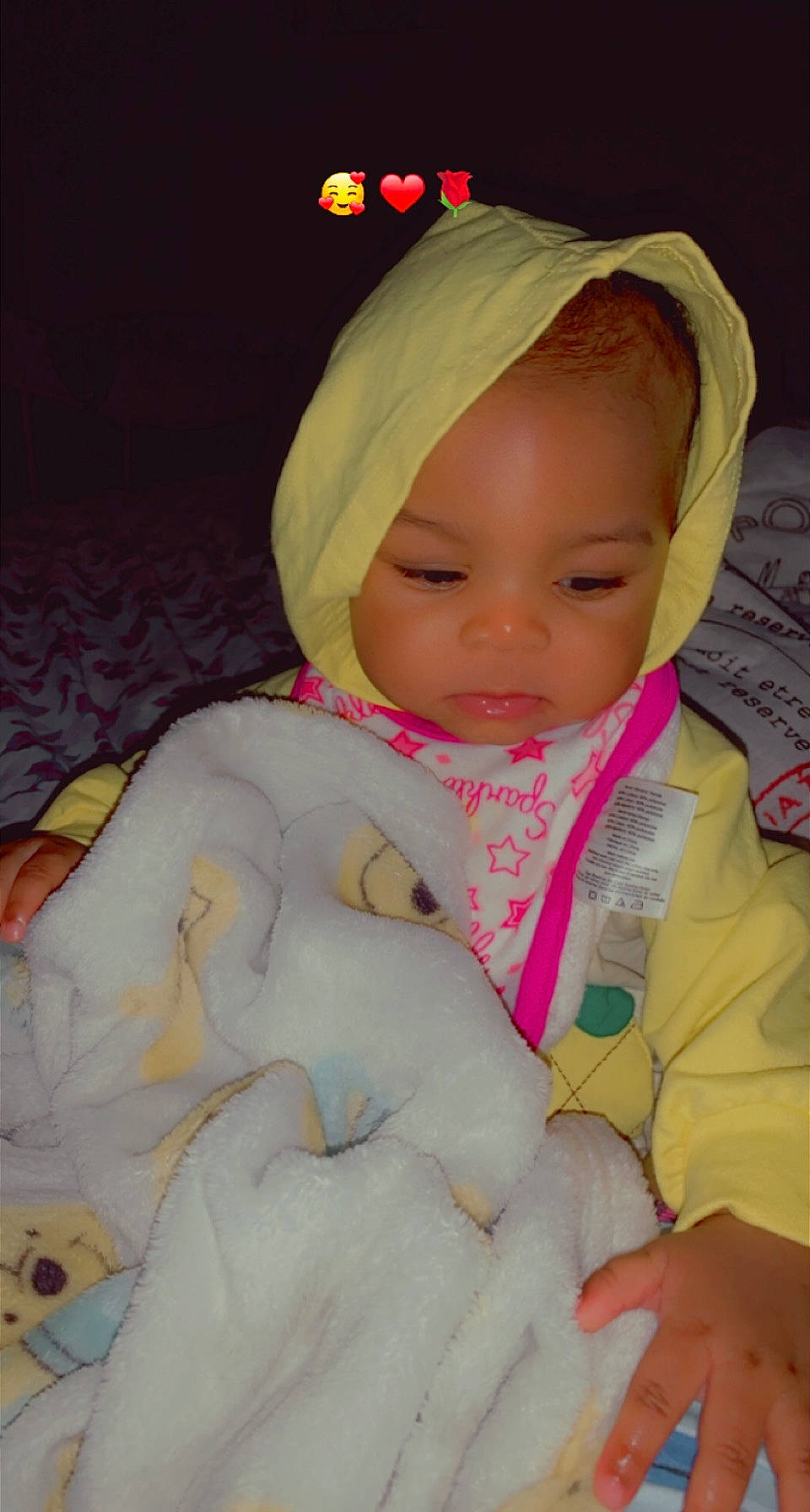 Zaniyah is registered to the contest to win money with this photo: baby, baby_toddler_clothing, cap, cheek, comfort, face, facial_expression, finger, happy, head, lip, mammal, mouth, nose, outerwear, person, pink, skin, sleeve, textile