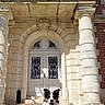 animal, arched_door, architecture, border_collie, building, canine, columns, daylight, dog, façade, happy, masonry, outdoor, pet, resting, shadow, stairs, stone_steps, sunlight, tongue_out