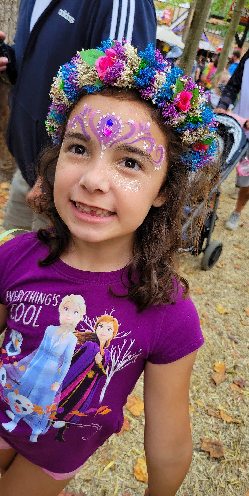 Victoria is registered to the contest to win money with this photo: child, community, event, facial_expression, fashion_accessory, fun, green, happy, headpiece, headwear, human, jewellery, leisure, magenta, person, pink, purple, recreation, sleeve, smile