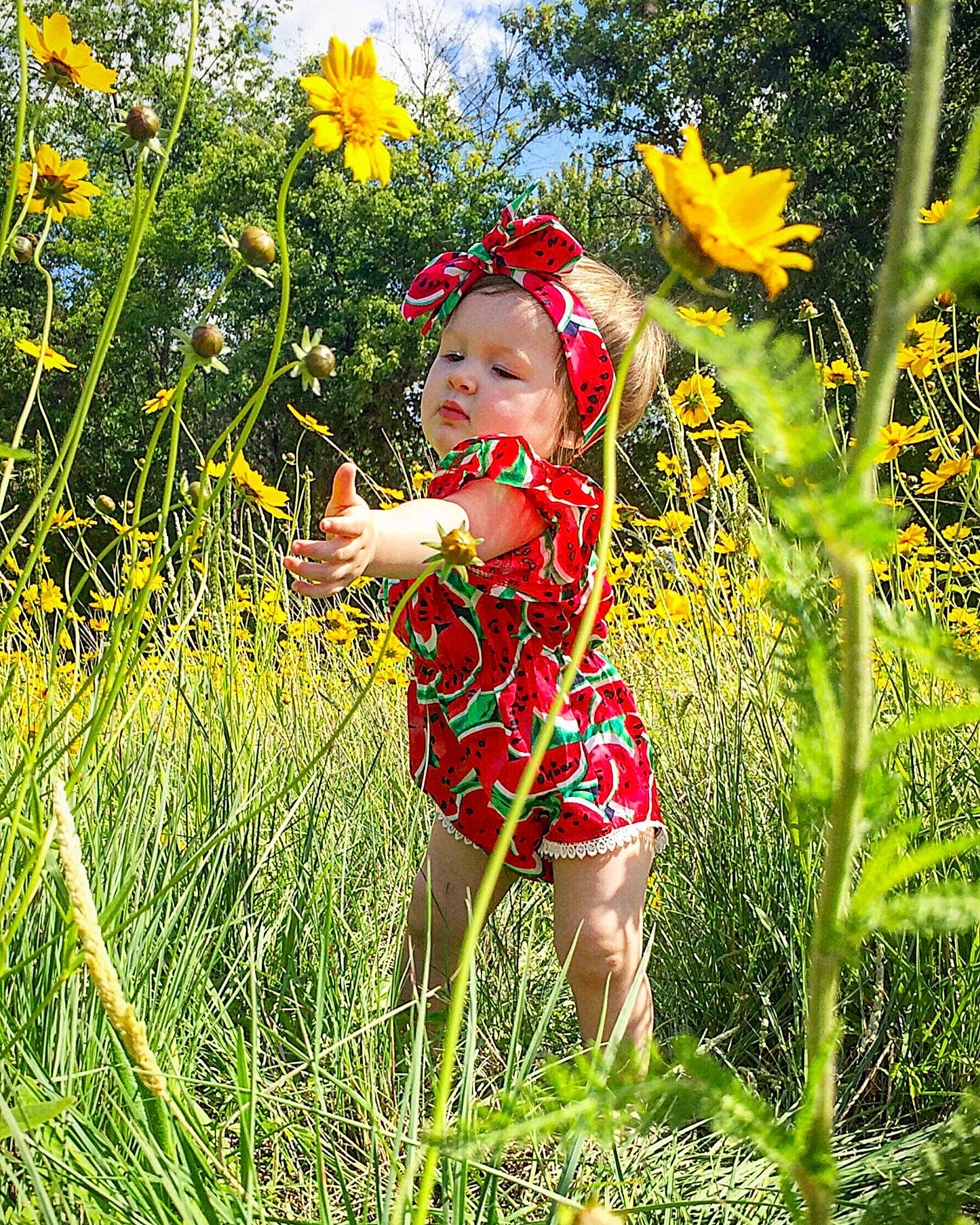 Kaydence joined the competition — help win amazing prizes! child, flower, flowering_plant, fun, grass, grass_family, happy, meadow, people_in_nature, person, photography, plant, prairie, smile, spring, summer, sunlight, toddler, wheel, wildflower