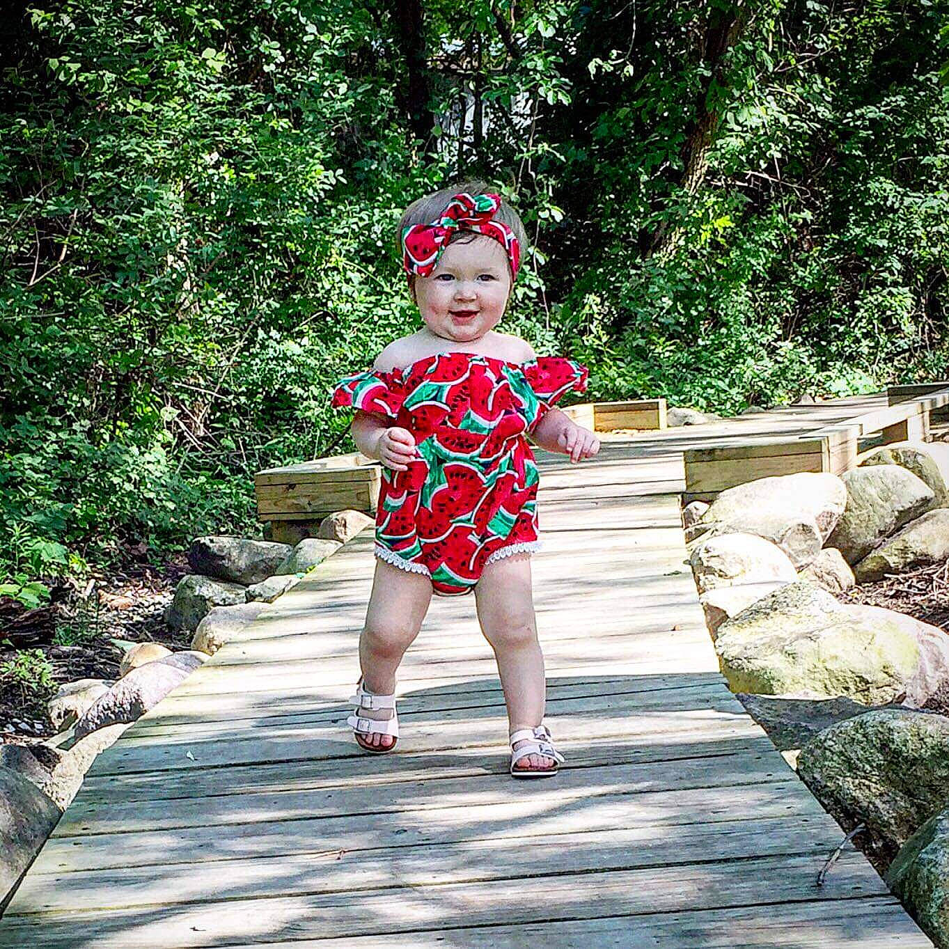Kaydence is registered to the contest to win money with this photo: botany, bridge, child, dress, fun, joy, leisure, person, plant, recreation, summer, toddler, tourism, tree, vacation, walkway