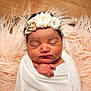 Kanova is registered to the contest to win money with this photo: newborn, baby, sleeping, blanket, headband, flower, infant, swaddled, soft, cozy, portrait, peaceful, cute, child, skin, hand, resting, fluffy, fabric, closeup