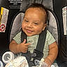 Zoriann joined the competition — help win amazing prizes! baby, child, car_seat, smiling, pacifier, blanket, hand, infant, clothing, person, seatbelt, indoor, cute, happy, portrait, baby_toy, comfortable, young_child, sitting, car_seat_harness