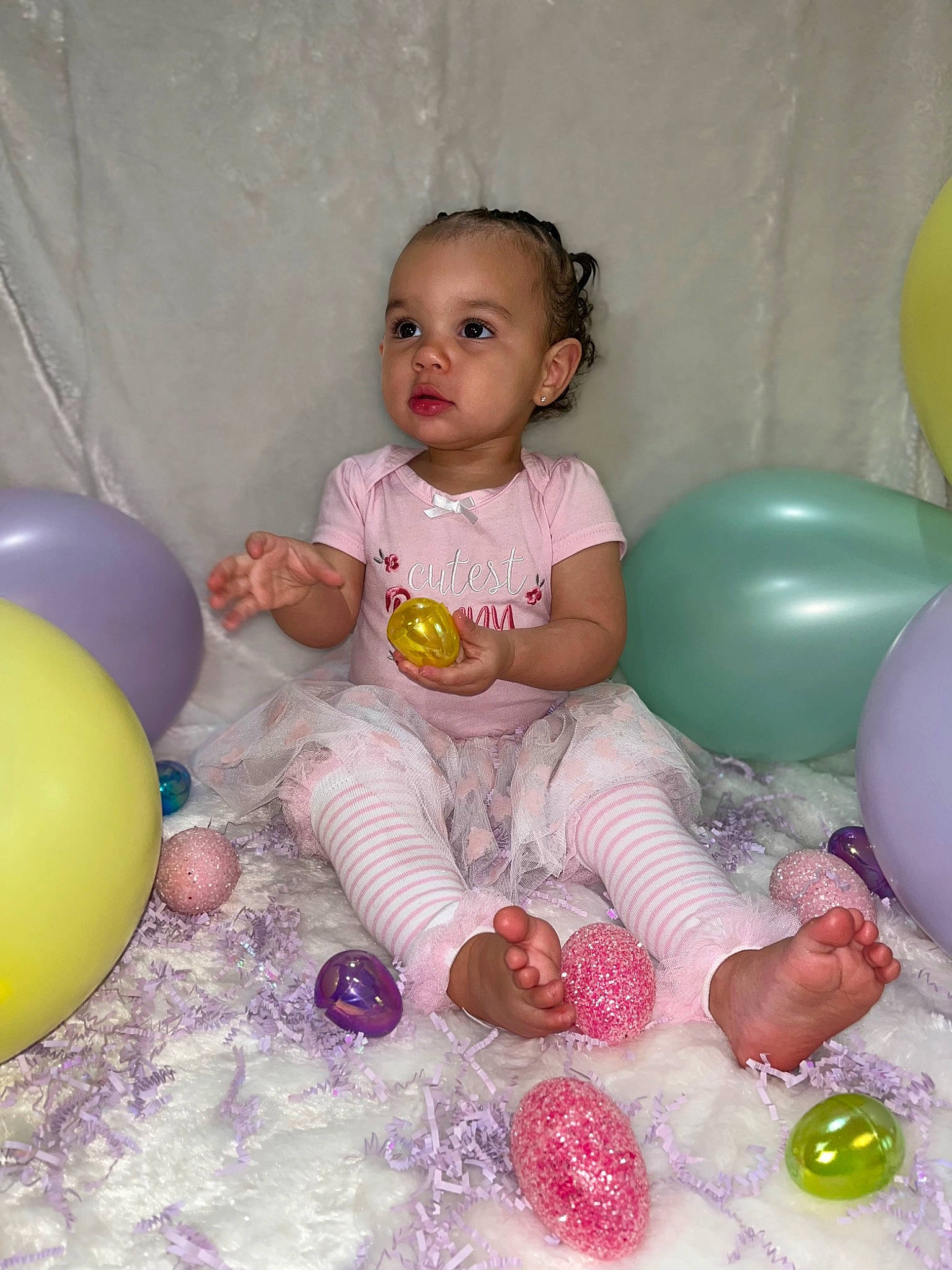 Maliyah is registered to the contest to win money with this photo: baby, baby_toddler_clothing, balloon, chair, child, event, fun, happy, leisure, party, party_supply, person, pink, play, purple, recreation, room, sitting, toddler, toy