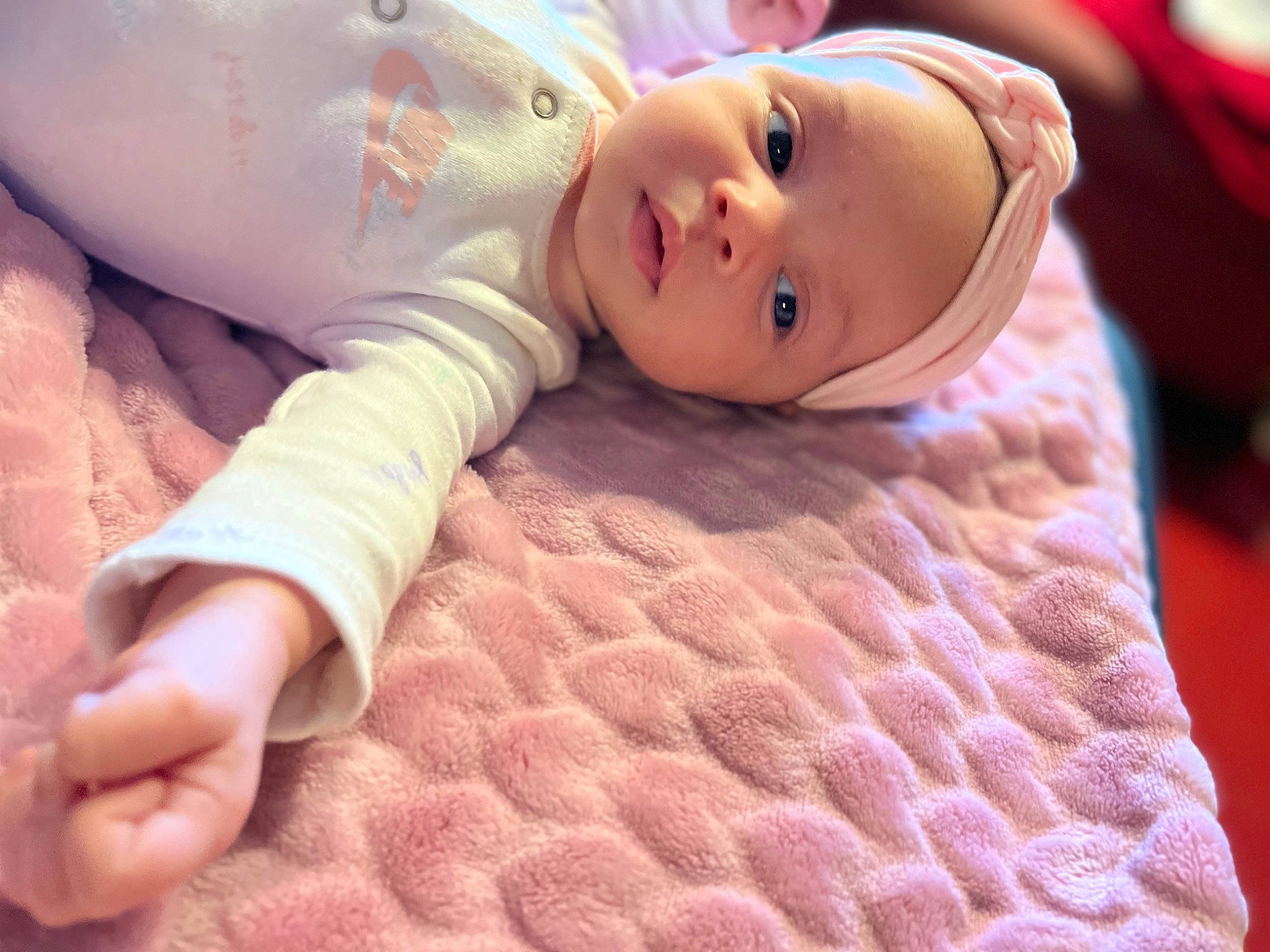 Mylah is registered to the contest to win money with this photo: baby, baby_toddler_clothing, beauty, cheek, close_up, comfort, eyelash, finger, happy, headwear, linens, lip, nose, person, pink, skin, textile, thumb, toddler, toy