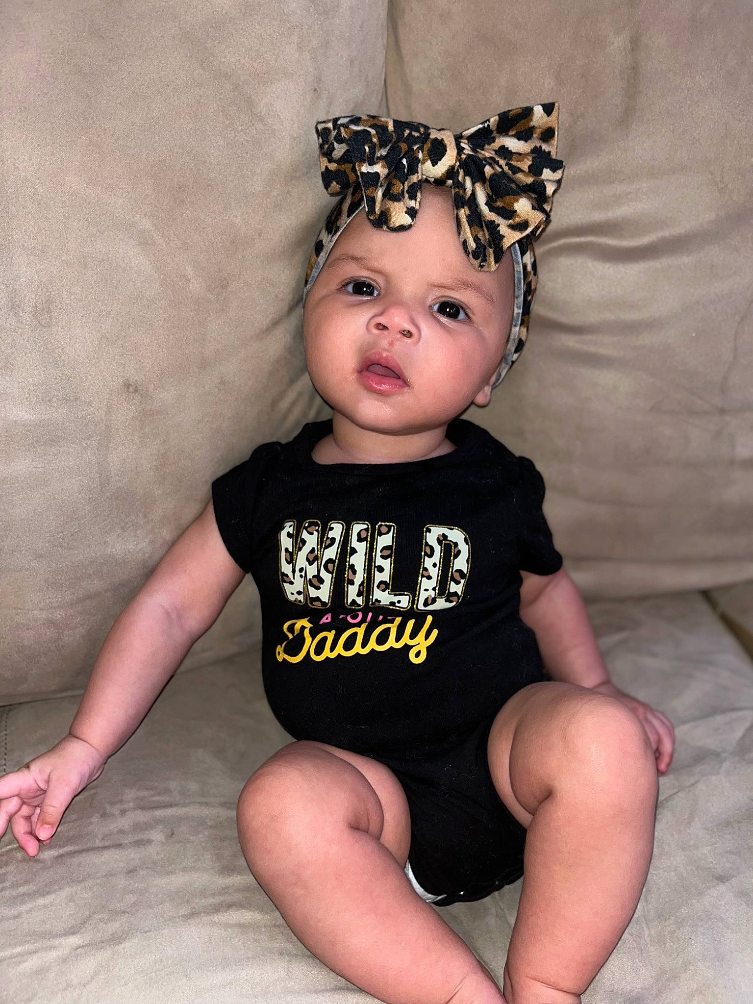 Mylah is registered to the contest to win money with this photo: baby, baby_toddler_clothing, cap, costume_hat, eye, eyelash, fun, happy, head, headband, headpiece, headwear, human_leg, jewellery, knee, leg, pattern, person, personal_protective_equipment, sleeve