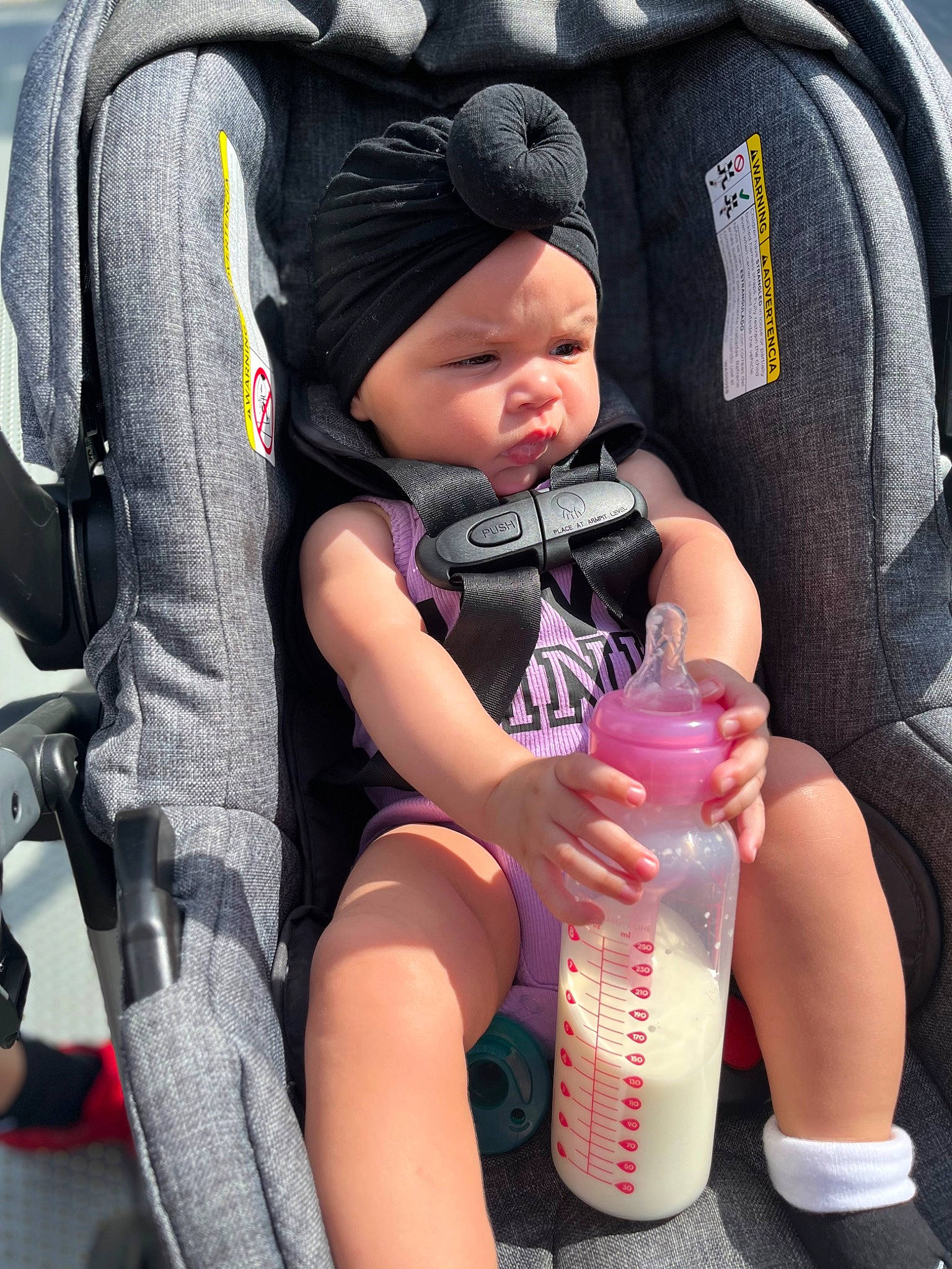 Mylah joined the competition — help win amazing prizes! baby, baby_carriage, baby_products, baby_toddler_clothing, bottle, cap, child, comfort, finger, headwear, human_leg, liquid, nail, person, photograph, plastic_bottle, product, sitting, skin, snapshot