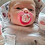baby, pacifier, blanket, infant, clothing, face, head, person, newborn, lying_down, soft_toy, comfort, indoor, skin, cute, young_child, sleepwear, snug, closeup, resting