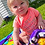 toddler, child, toy, pink_toy_car, blanket, grass, outdoor, sunny, house, greenery, coral_shirt, smiling, sitting, baby, play, daylight, person, cute, fun, happy