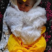 Phoebe is registered to the contest to win money with this photo: baby, blanket, chicken_costume, child, costume, cozy, cute, face, feet, hood, indoor, infant, orange, patterned_chair, plush, portrait, seated, soft, white, yellow