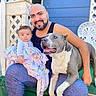 Blue joined the competition — help win amazing prizes! animal, baby, beard, blanket, blue_wall, cute, dog, family, green_turf, happy, human, lattice, man, outdoor, pet, portrait, sitting, smiling, tank_top, white_chair