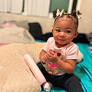 Dream joined the competition — help win amazing prizes! toddler, child, baby, indoor, bed, pillow, pink_shirt, black_pants, bracelet, necklace, hair_accessories, butterfly, curly_hair, sitting, holding_object, cute, portrait, person, cozy, soft_lighting