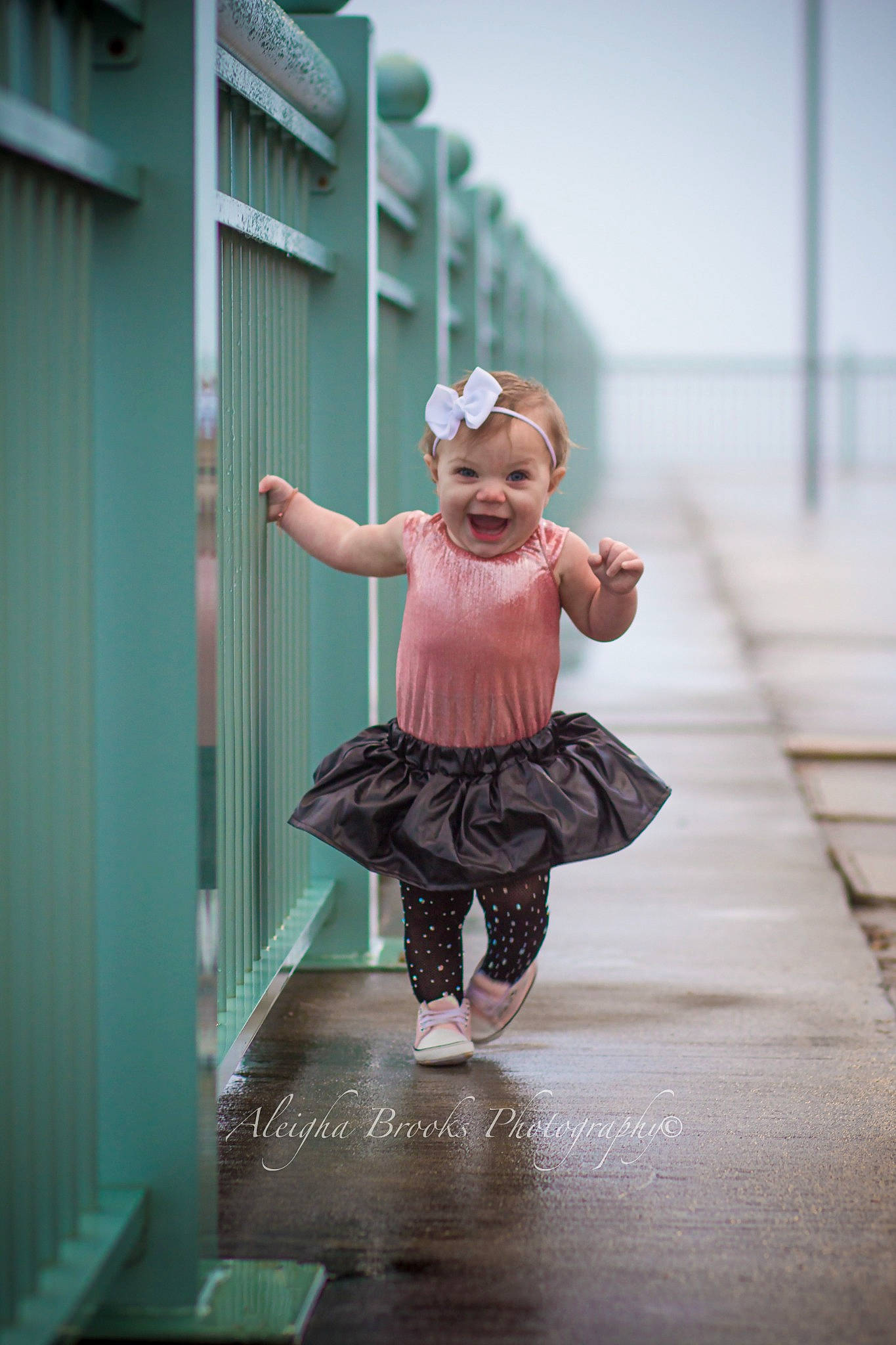 Caroline is registered to the contest to win money with this photo: child, costume, fashion_design, flash_photography, floor, flooring, fun, happy, human_leg, joy, leisure, magenta, pattern, person, pink, reflection, room, sitting, smile, toddler