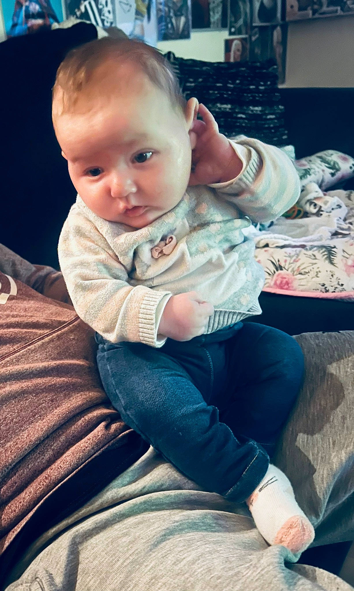 Aaliyah is registered to the contest to win money with this photo: baby, baby_toddler_clothing, cheek, child, comfort, cool, eye, finger, hairstyle, happy, head, human_leg, iris, jeans, lap, leg, person, sitting, skin, thigh