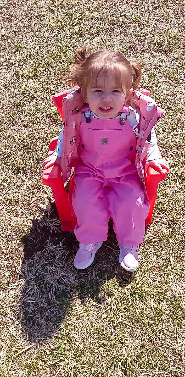 Aleyna is registered to the contest to win money with this photo: baby_toddler_clothing, boot, child, clothing, fun, grass, happy, kneeling, magenta, people_in_nature, person, pink, play, sitting, sleeve, smile, soil, toddler