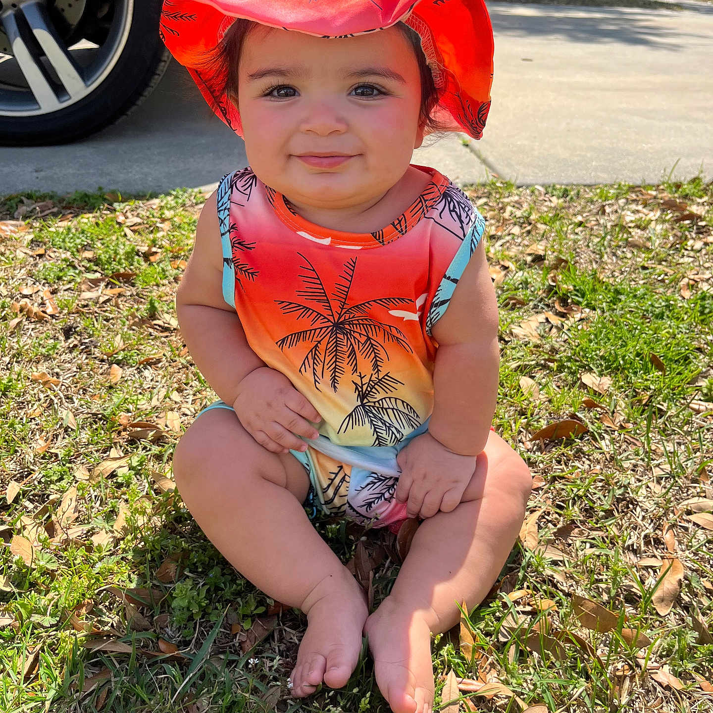 Wyatt joined the competition — help win amazing prizes! alloywheel, baby, car, carwheel, clothing, face, grass, hat, head, machine, person, photography, plant, portrait, spoke, summer, tire, transportation, vehicle, wheel