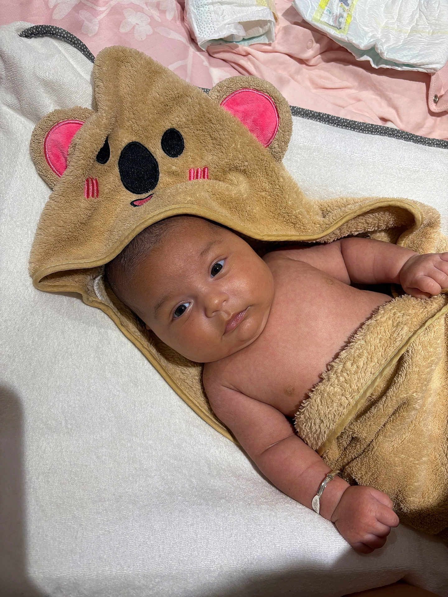 Pearl-Rose joined the competition — help win amazing prizes! baby, infant, towel, koala, hooded_towel, blanket, cute, skin, arm, hand, bracelet, lying_down, indoors, soft_texture, sleepwear, child, portrait, face, expression, newborn