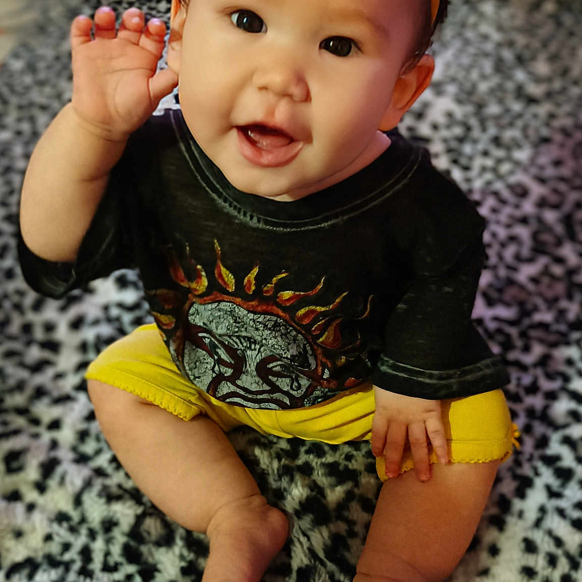 Luna joined the competition — help win amazing prizes! accessories, baby, babylaughing, bodypart, clothing, face, finger, hand, happy, head, headband, mouth, pants, person, photography, portrait, shorts, sitting, smile, t_shirt