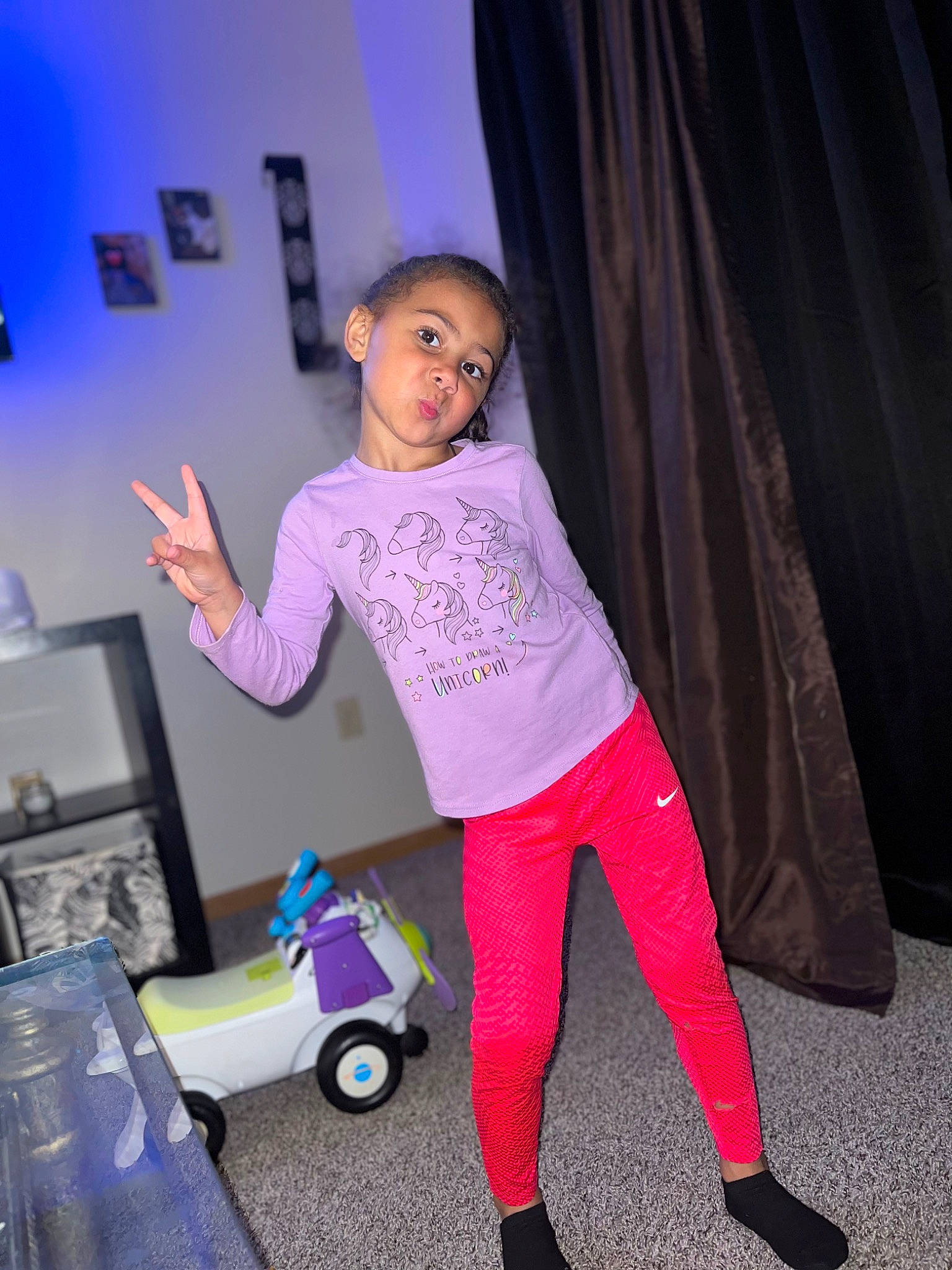 Avah Jean is registered to the contest to win money with this photo: chair, curtain, electric_blue, entertainment, event, flooring, fun, home_appliance, leisure, magenta, performing_arts, person, pink, purple, room, sandal, t_shirt, tire, toddler, toy