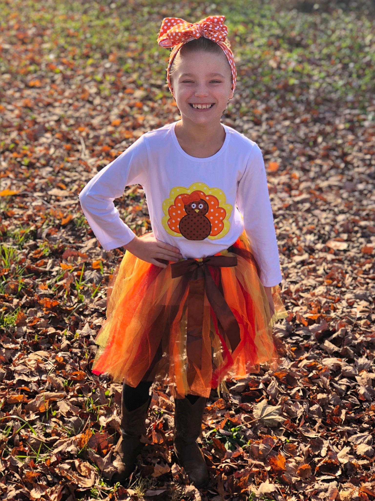Coralyne is registered to the contest to win money with this photo: autumn, child, dress, fawn, joy, leaf, orange, person, plant, pumpkin, smile