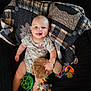 Silas joined the competition — help win amazing prizes! baby, infant, smiling, toy, plush_toy, blanket, quilt, clothing, onesie, hand, foot, face, child, happy, cute, indoor, person, playtime, colorful, soft_toy