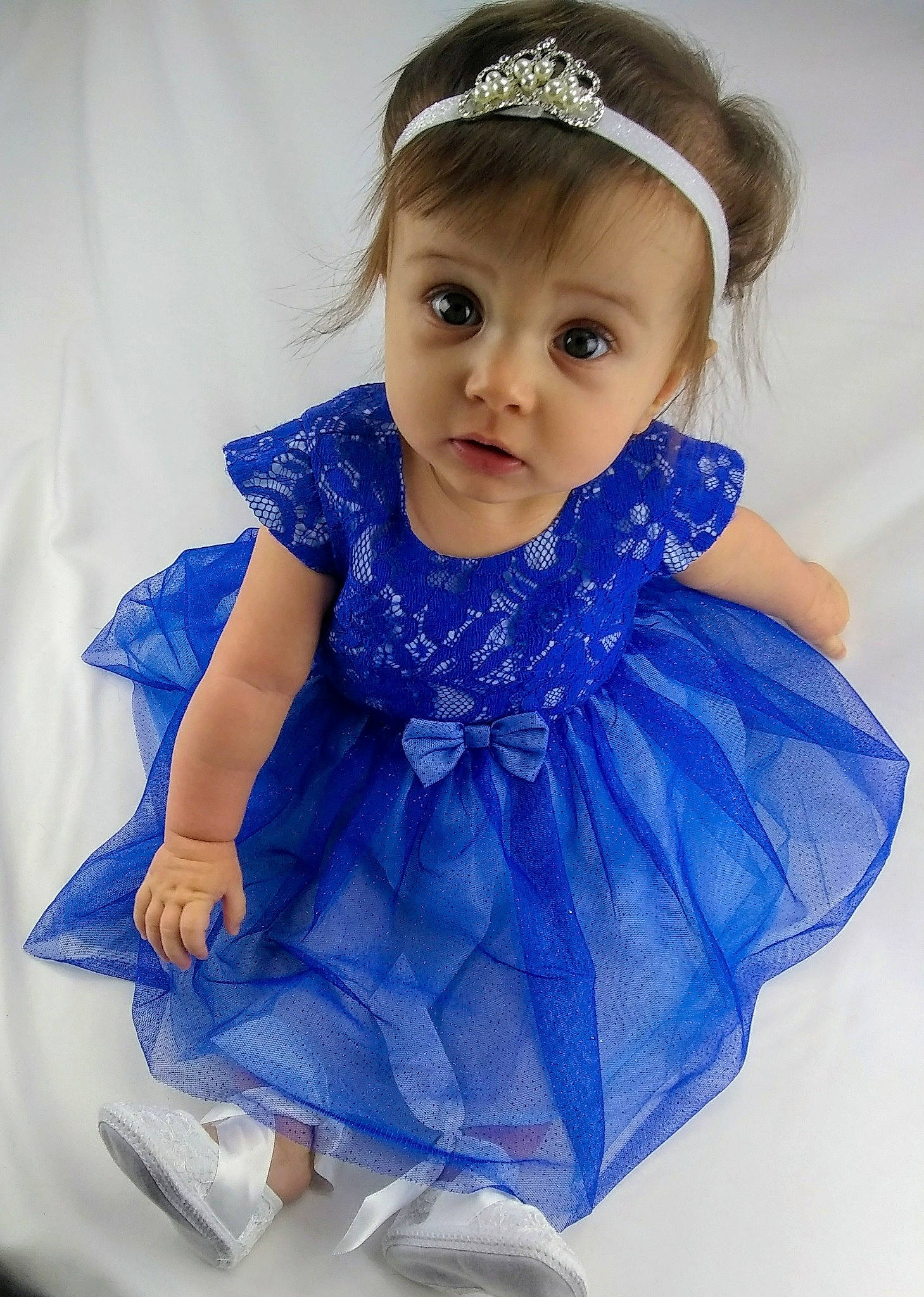 Hayley is registered to the contest to win money with this photo: baby, baby_toddler_clothing, blue, child, child_model, clothing, costume, dress, electric_blue, fashion_accessory, hair_accessory, headband, headgear, headpiece, pattern, person, ruffle, smile, textile, toddler