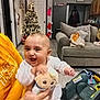Deja joined the competition — help win amazing prizes! baby, smiling, toy, stuffed_animal, person, hand, living_room, christmas_tree, stockings, sofa, car_seat, floor, door, light, clothing, tattoo, holiday, festive, interior, home
