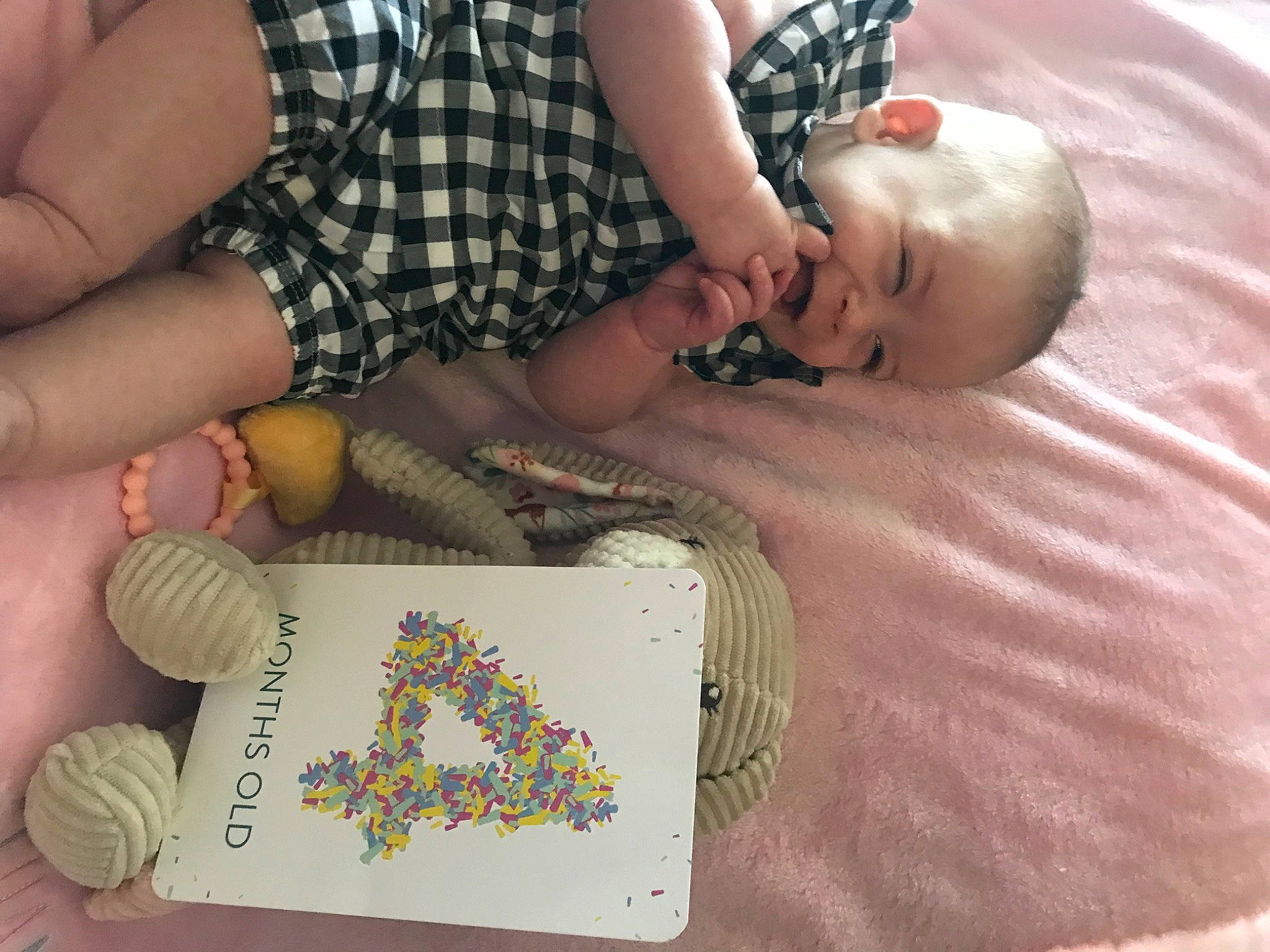 Claire joined the competition — help win amazing prizes! baby, baby_products, baby_toddler_clothing, child, circle, comfort, finger, flooring, fun, human_leg, linens, nail, pattern, person, plaid, play, sitting, thigh, toddler