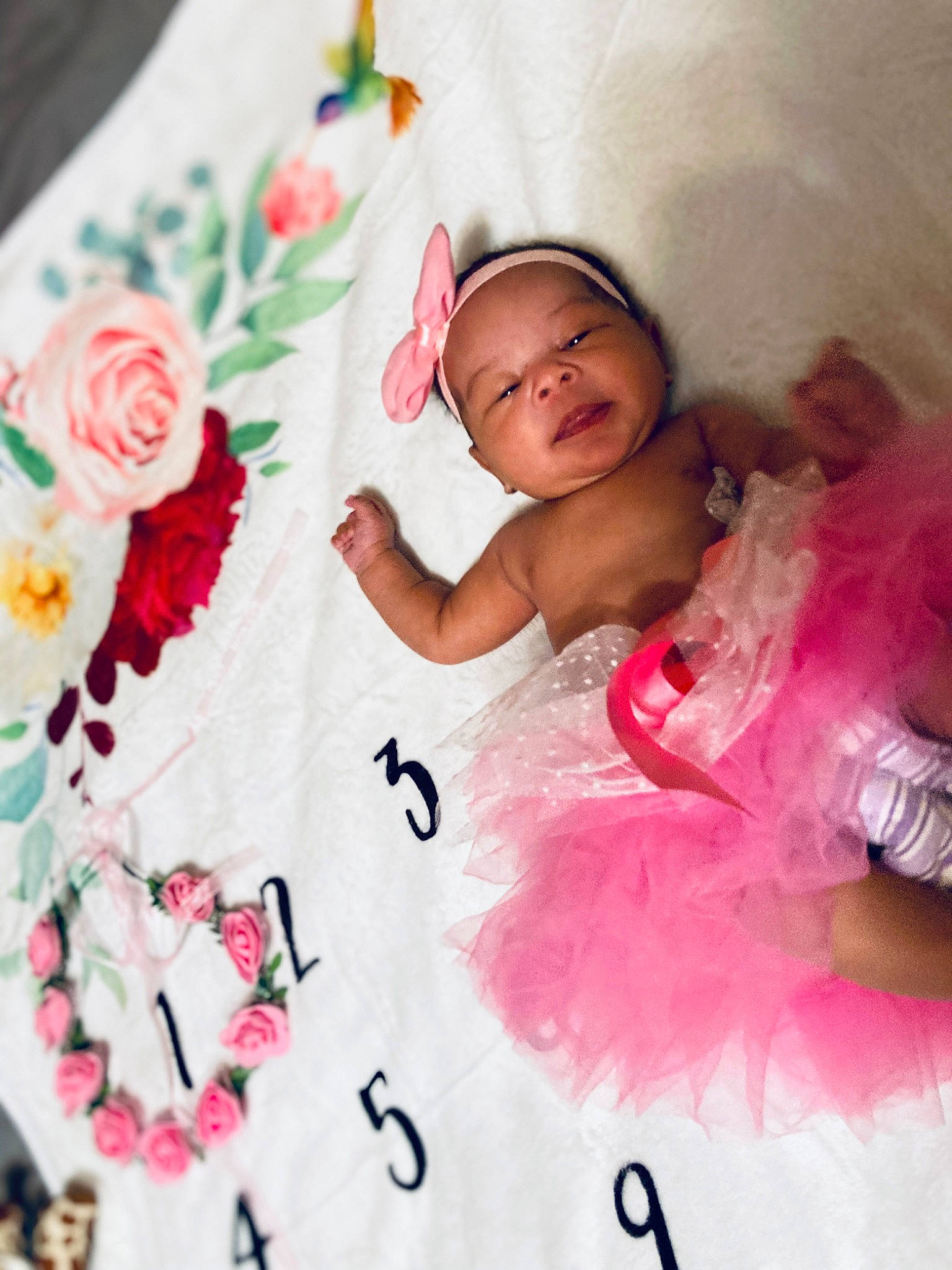 Leyah is registered to the contest to win money with this photo: baby, baby_toddler_clothing, beauty, child, dress, embellishment, flower, happy, linens, magenta, pattern, peach, person, petal, pink, plant, rose, skin, sleeve, textile