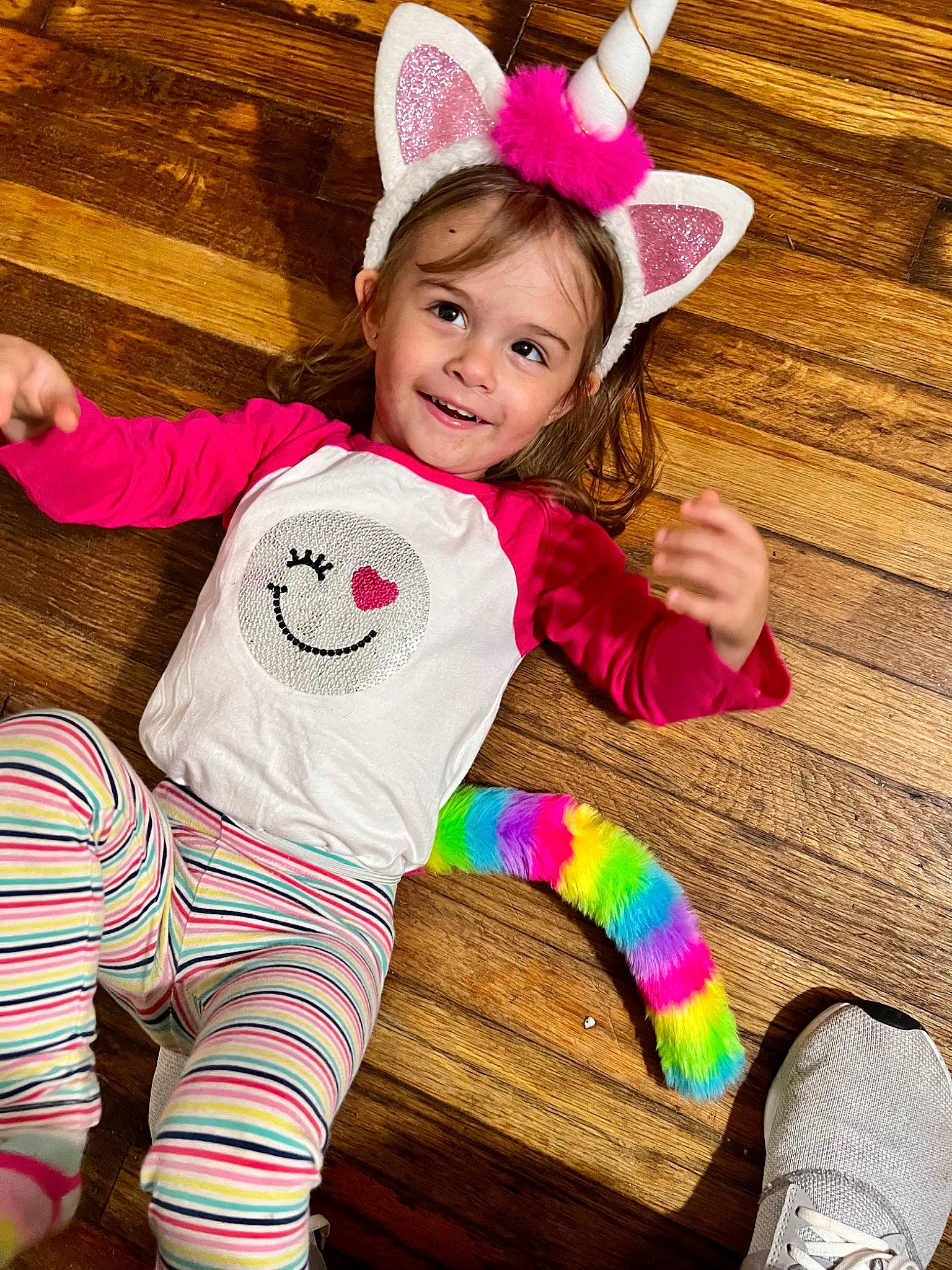 Blakeleigh is registered to the contest to win money with this photo: baby_toddler_clothing, cool, face, facial_expression, finger, fun, hair, happy, head, joy, mammal, person, pink, skin, sleeve, smile, sock, textile, thigh, toddler