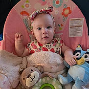 Summer joined the competition — help win amazing prizes! baby, child, infant, pink_baby_chair, headband, bow, blanket, plush_toy, blue_toy, stuffed_animal, smiling, cute, face, clothing, indoor, person, seat, pattern, unicorn, flower