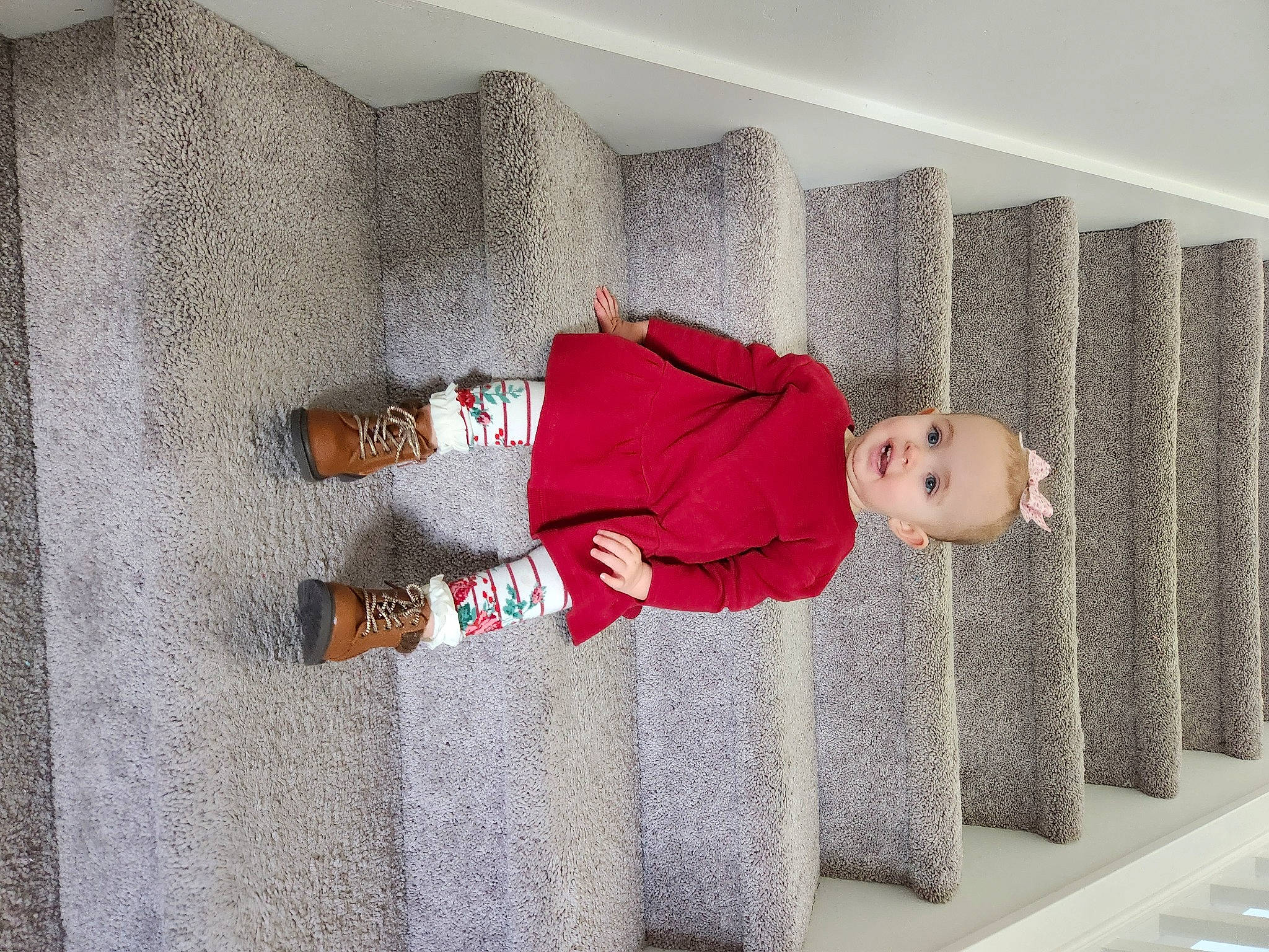 Londynn joined the competition — help win amazing prizes! carmine, child, comfort, concrete, floor, flooring, font, grey, hardwood, human_leg, joy, knee, linens, pattern, person, plant, rectangle, room, sock, toddler