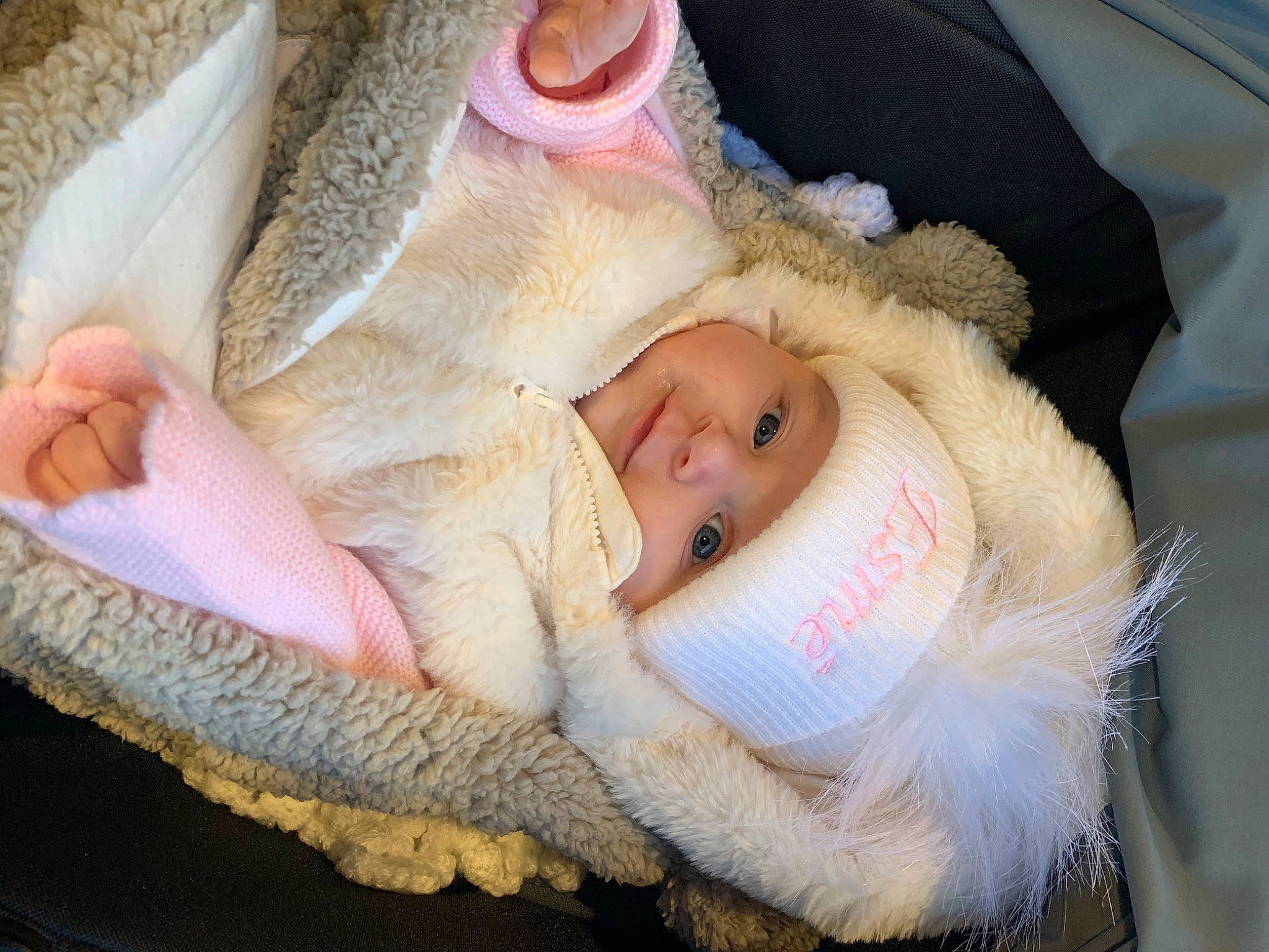Esmé is registered to the contest to win money with this photo: baby, baby_products, baby_toddler_clothing, cheek, child, comfort, ear, eye, eyelash, fur, happy, hat, headgear, headwear, human_body, lip, person, skin, smile, textile