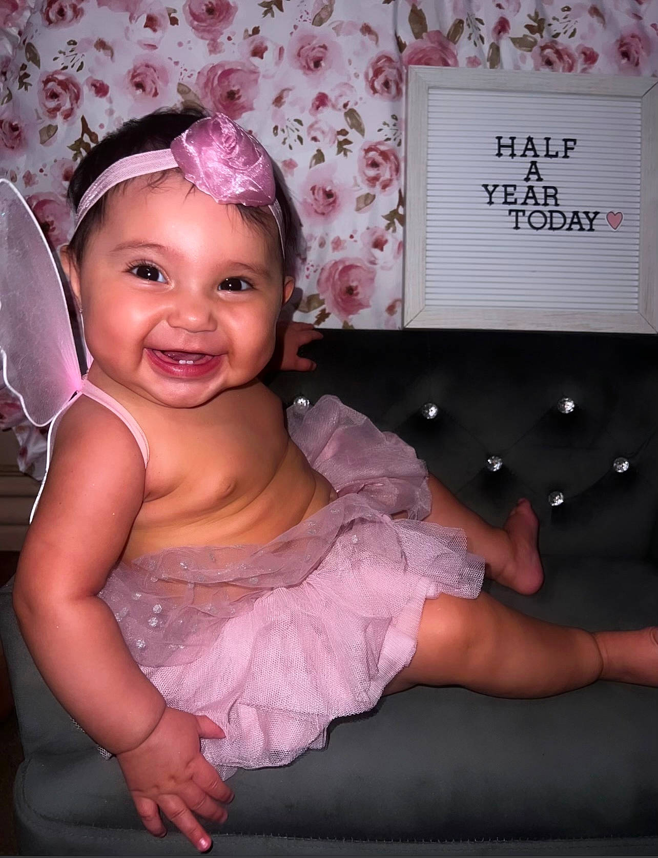 Alaia is registered to the contest to win money with this photo: baby_toddler_clothing, child, eyelash, fashion_accessory, flash_photography, fun, hair_accessory, happy, headband, headpiece, headwear, joy, magenta, pattern, person, pink, purple, room, skin, smile