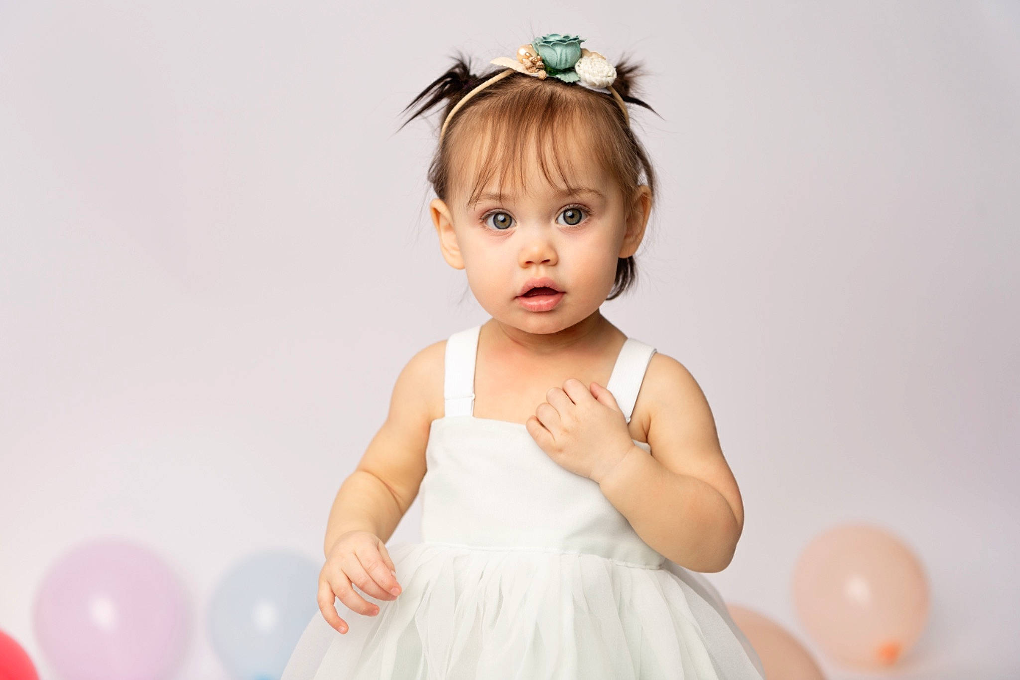 Ila joined the competition — help win amazing prizes! baby, baby_toddler_clothing, balloon, bridal_accessory, child, day_dress, dress, eyelash, finger, flash_photography, gesture, hair, happy, headpiece, iris, person, pink, shoulder, skin, sleeve
