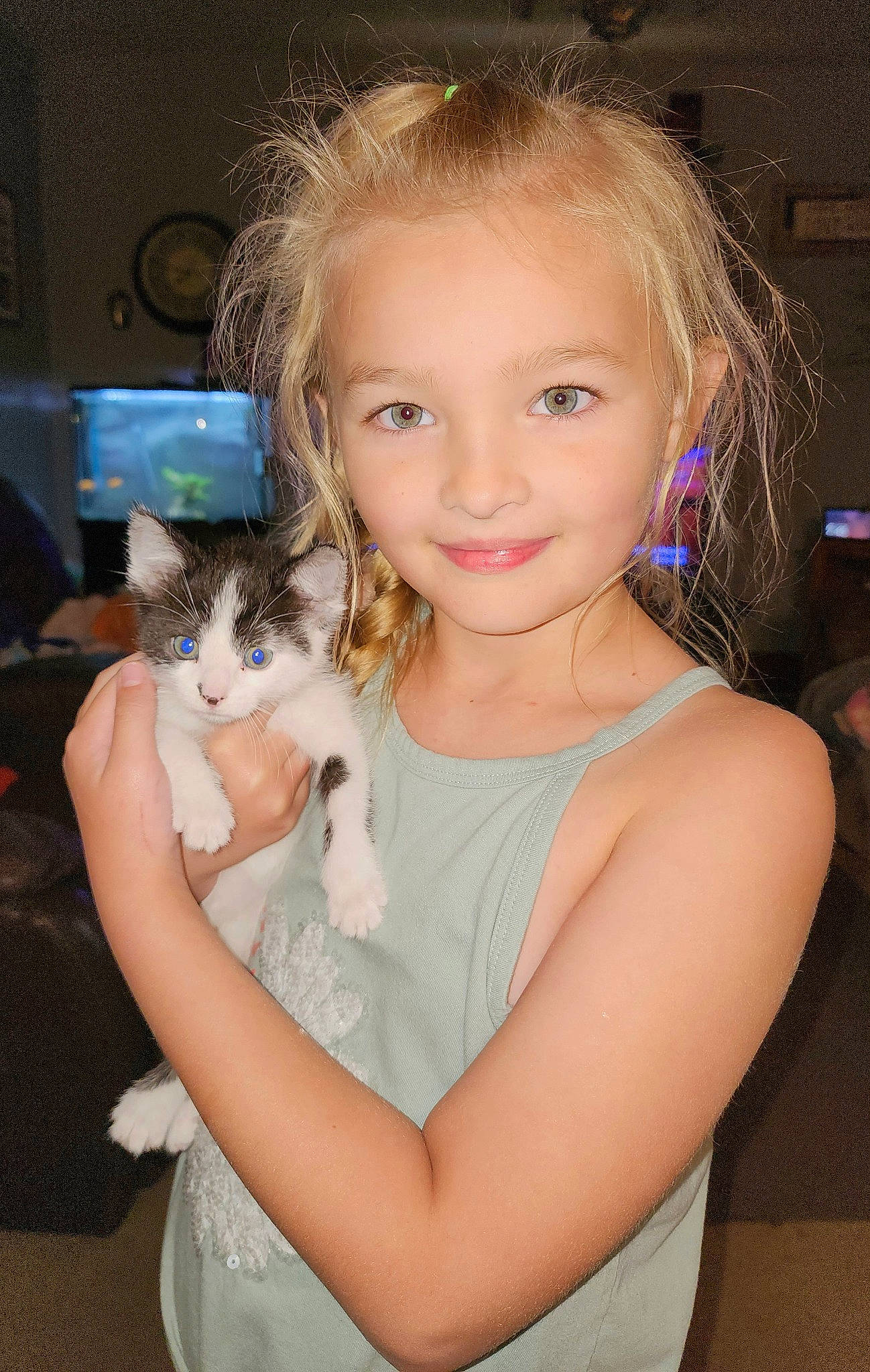 Aria is registered to the contest to win money with this photo: arm, carnivore, cat, eye, eyelash, facial_expression, fawn, felidae, flash_photography, gesture, hair, happy, head, human, iris, joy, organ, person, shoulder, skin