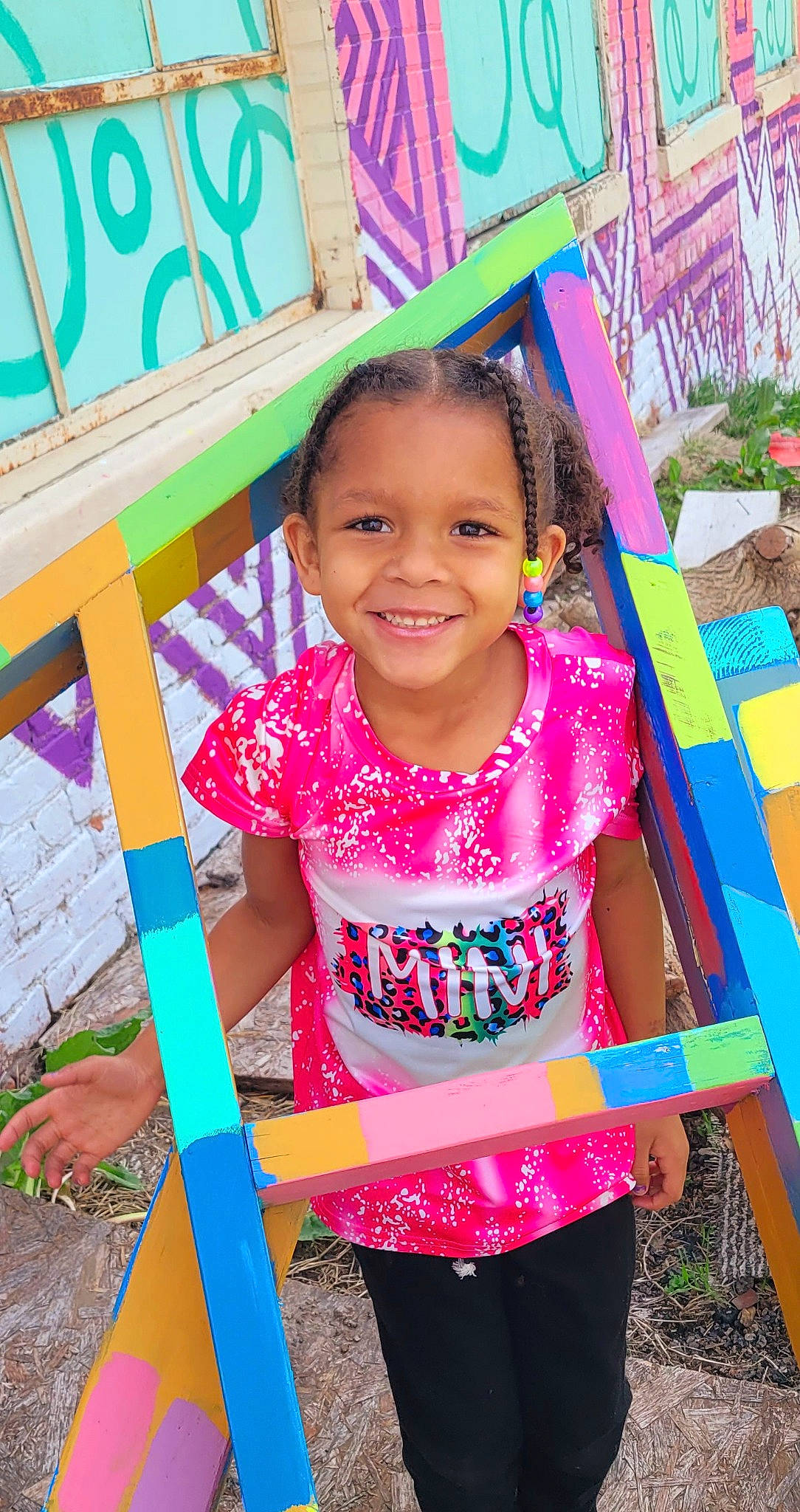 Zendaya is registered to the contest to win money with this photo: beauty, child, city, facial_expression, fun, grass, green, happy, human_settlement, joy, leisure, magenta, person, pink, plant, play, shorts, sleeve, smile, t_shirt