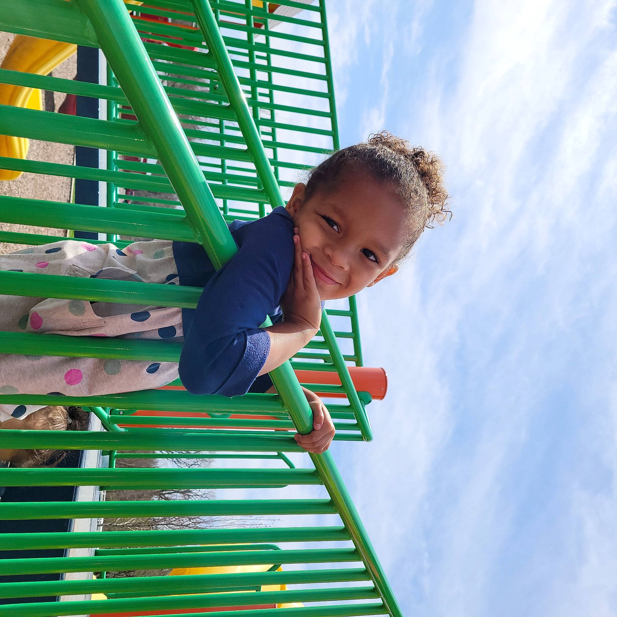 Zendaya is registered to the contest to win money with this photo: amusement_park, baby, baby_toddler_clothing, child, city, cloud, electric_blue, fun, happy, joy, leisure, nonbuilding_structure, outdoor_play_equipment, people_in_nature, person, play, playground, recreation, sky, smile
