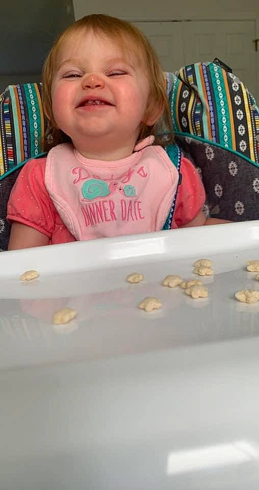 Leighton joined the competition — help win amazing prizes! baby, baby_products, baby_safety, baby_toddler_clothing, bookcase, cheek, child, eye, fun, happy, joy, person, pink, product, room, sitting, skin, sleeve, smile, t_shirt